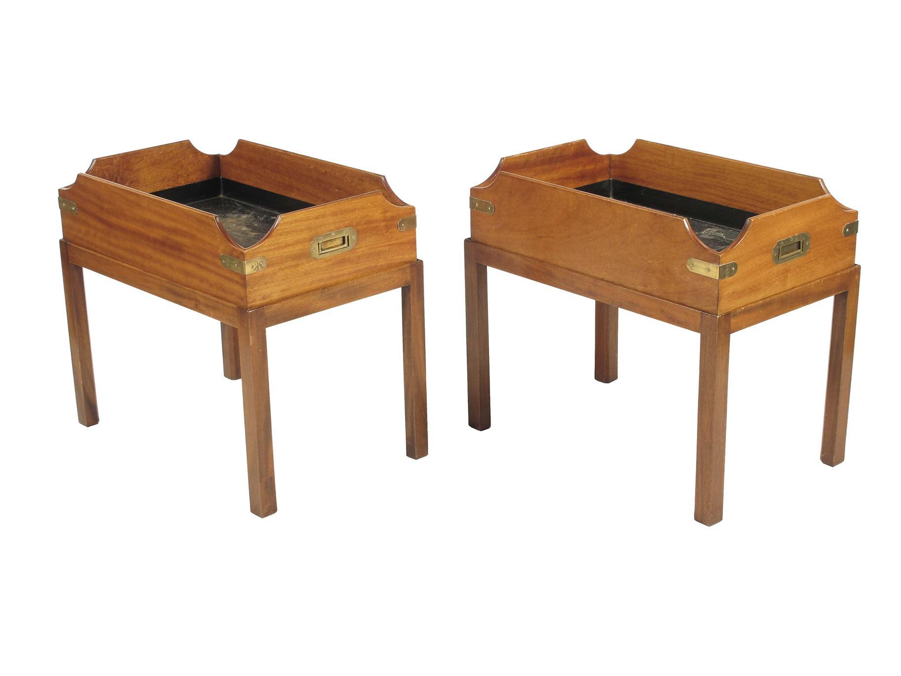 Appraisal: A pair of mahogany brass bound butler s trays on