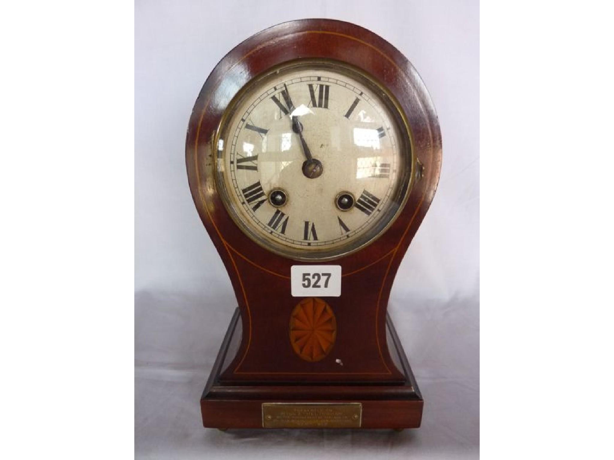 Appraisal: An Edwardian mahogany mantle clock with balloon shaped case with