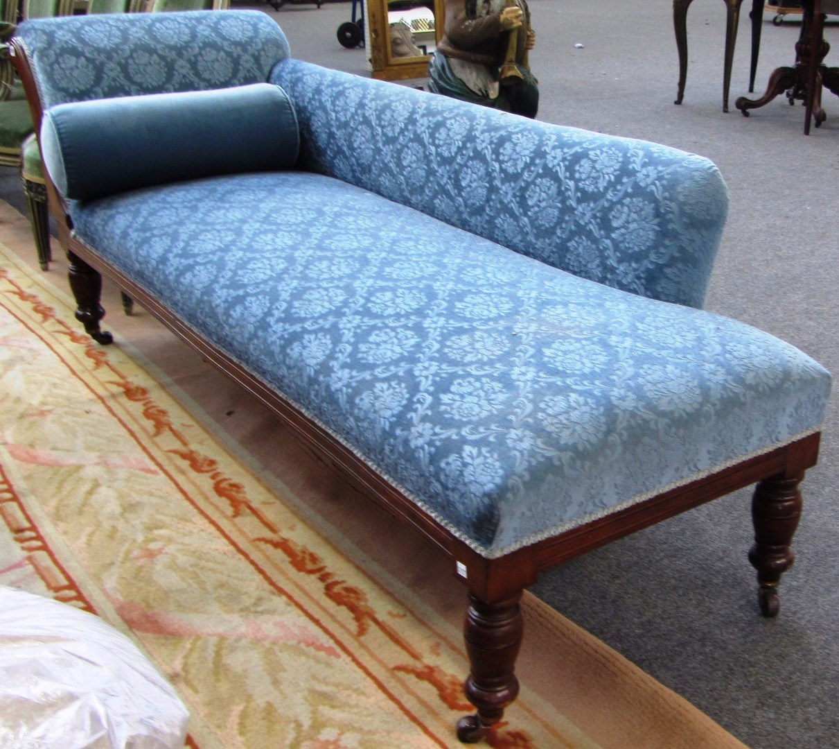 Appraisal: A late Victorian mahogany framed chaise lounge with roll over