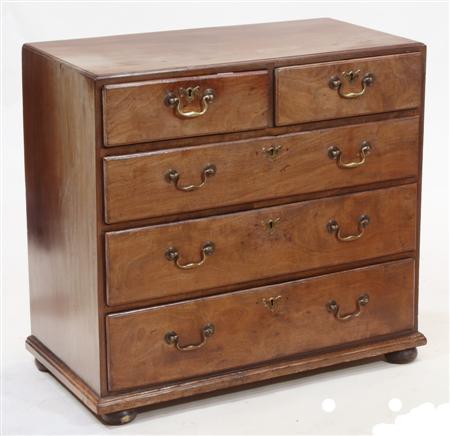 Appraisal: A Georgian mahogany chest the moulded rectangular top above two