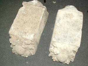 Appraisal: A pair of carved sandstone architectural keystones decorated with masks