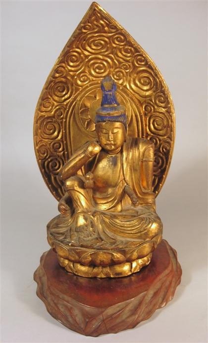 Appraisal: Japanese giltwood deity th century Carved wood and gilded figure