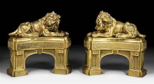 Appraisal: PAIR OF GILT BRONZE FIREPLACE CHENETS WITH LIONS Louis XVI