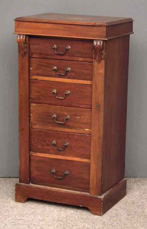 Appraisal: A late Victorian mahogany ''Wellington'' chest fitted six drawers enclosed