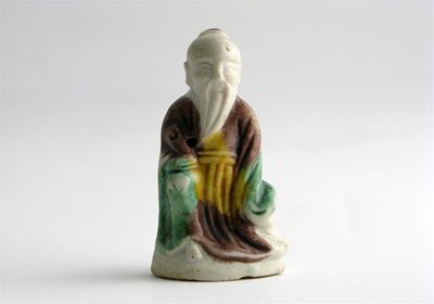 Appraisal: A small Chinese model of a sage enamelled on the