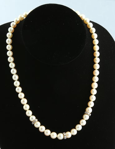 Appraisal: strand of mm round pearls with diamond and pearl accented