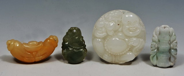 Appraisal: A CHINESE GREEN JADE PENDANT carved as a gourd another