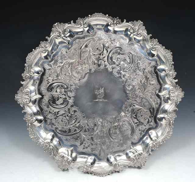 Appraisal: A GEORGE III SILVER SALVER with cast shell and leaf