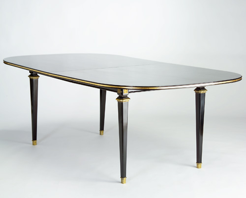 Appraisal: STYLE OF JACQUES ADNET Extension dining table with a gilded-edge