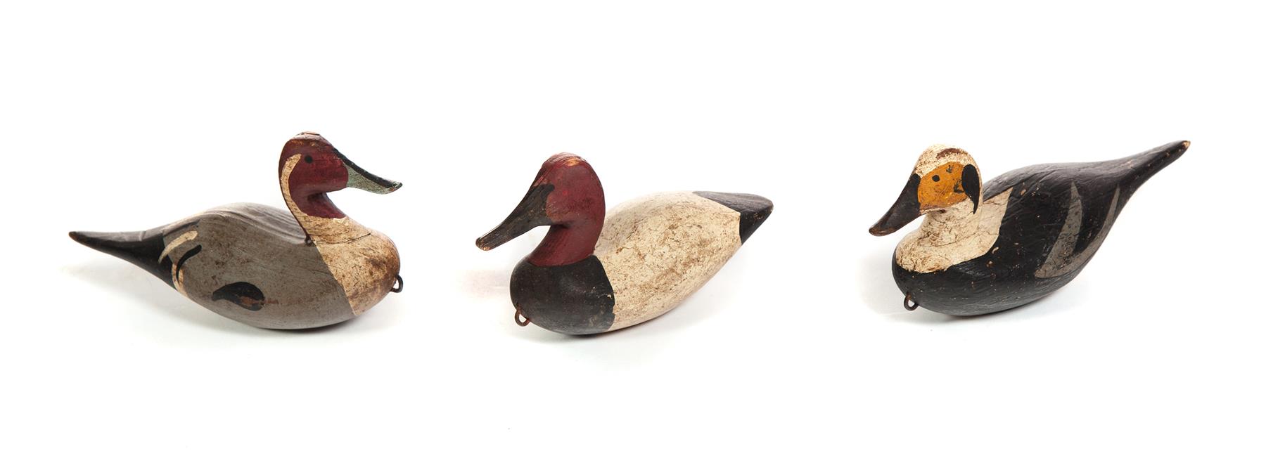 Appraisal: THREE AMERICAN MINIATURE DECOYS Second half- th century Duck decoys