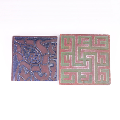 Appraisal: GRUEBY AETCO Two red clay floor tiles with impressed design