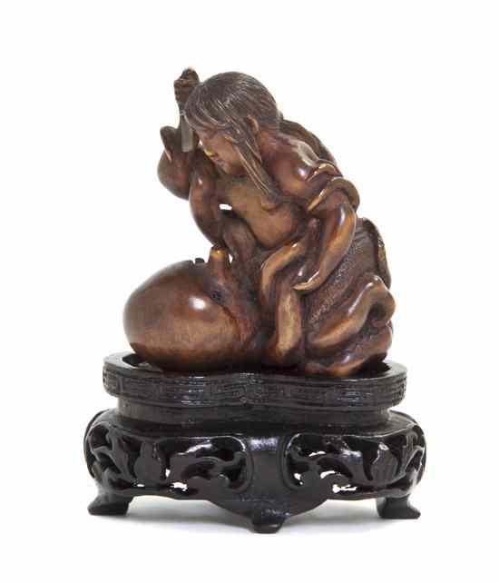 Appraisal: A Boxwood Netsuke of a Pearl Diver and Octopus the