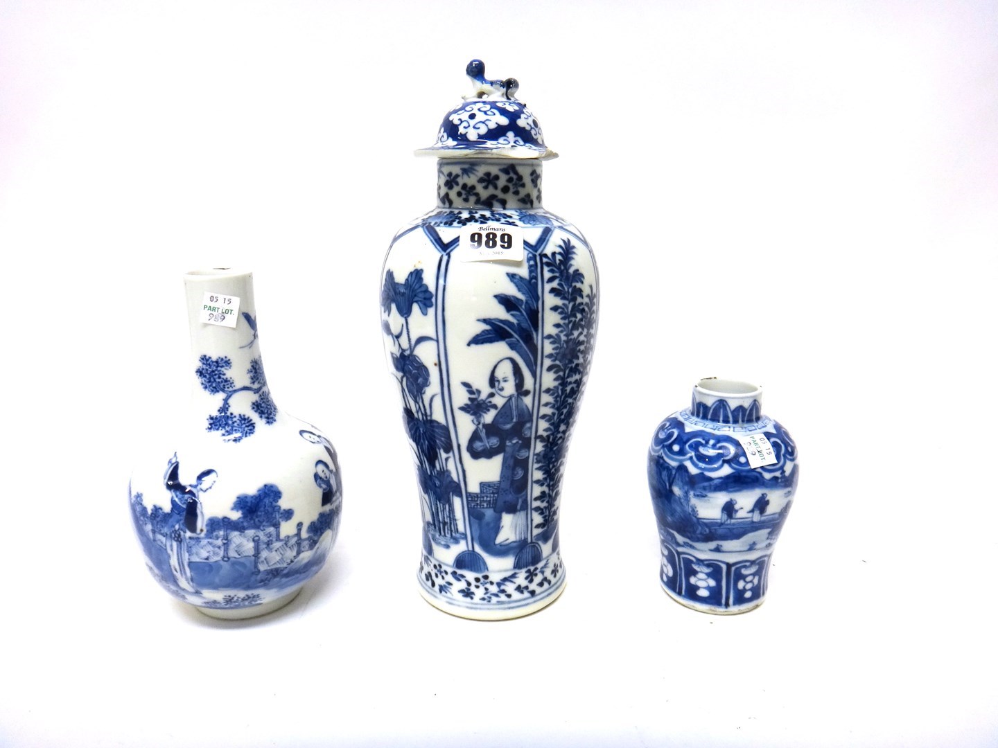 Appraisal: Three Chinese blue and white vases and one matched cover