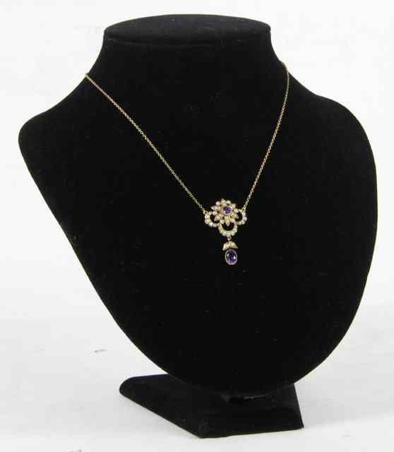 Appraisal: An Edwardian amethyst and seed pearl set necklace the flowerhead