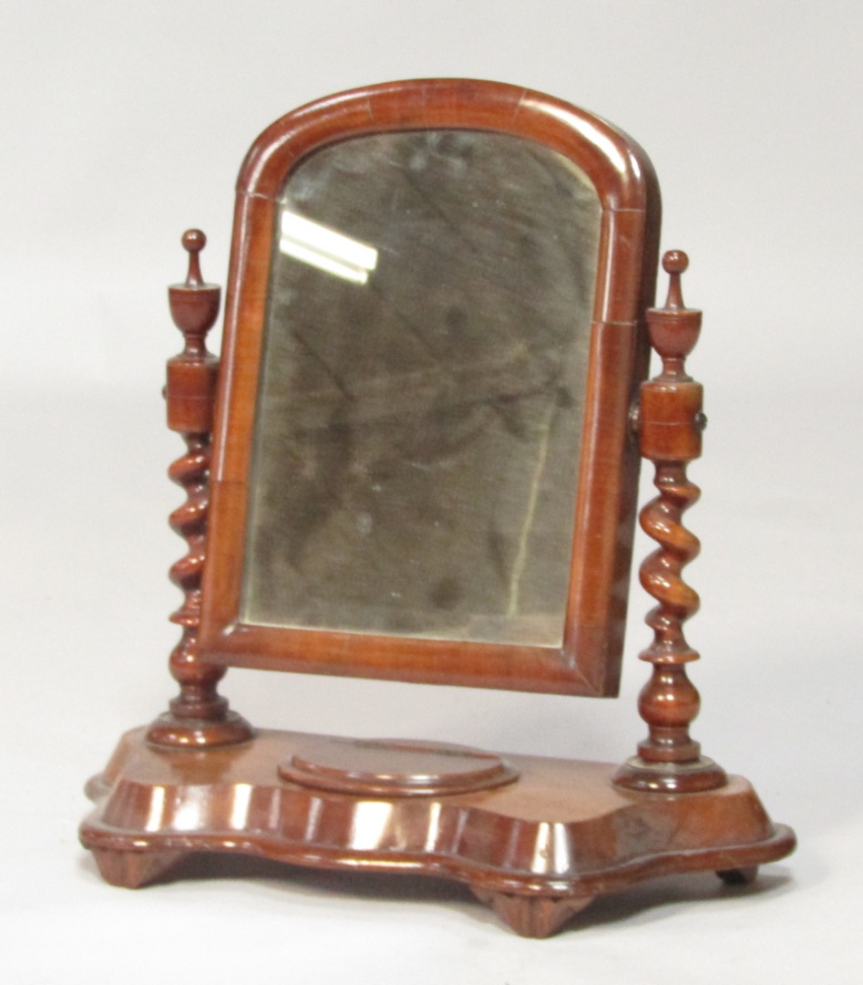 Appraisal: A Victorian mahogany toilet mirror the domed mirror within a