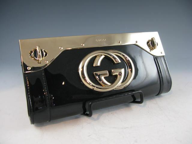 Appraisal: Black Patent Leather Gucci Clutch with original price tag of