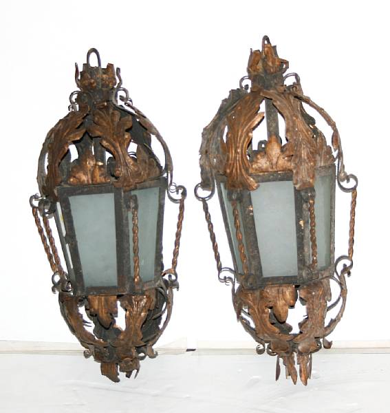 Appraisal: A pair of tole and wrought iron lanterns with wall