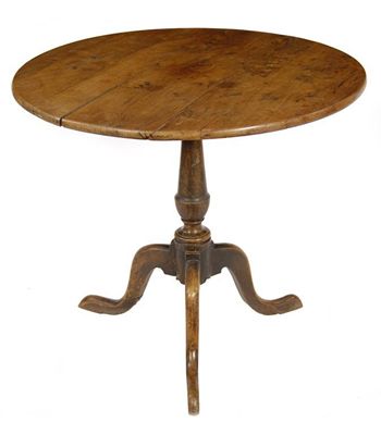 Appraisal: A George III tripod table the circular yew snap top