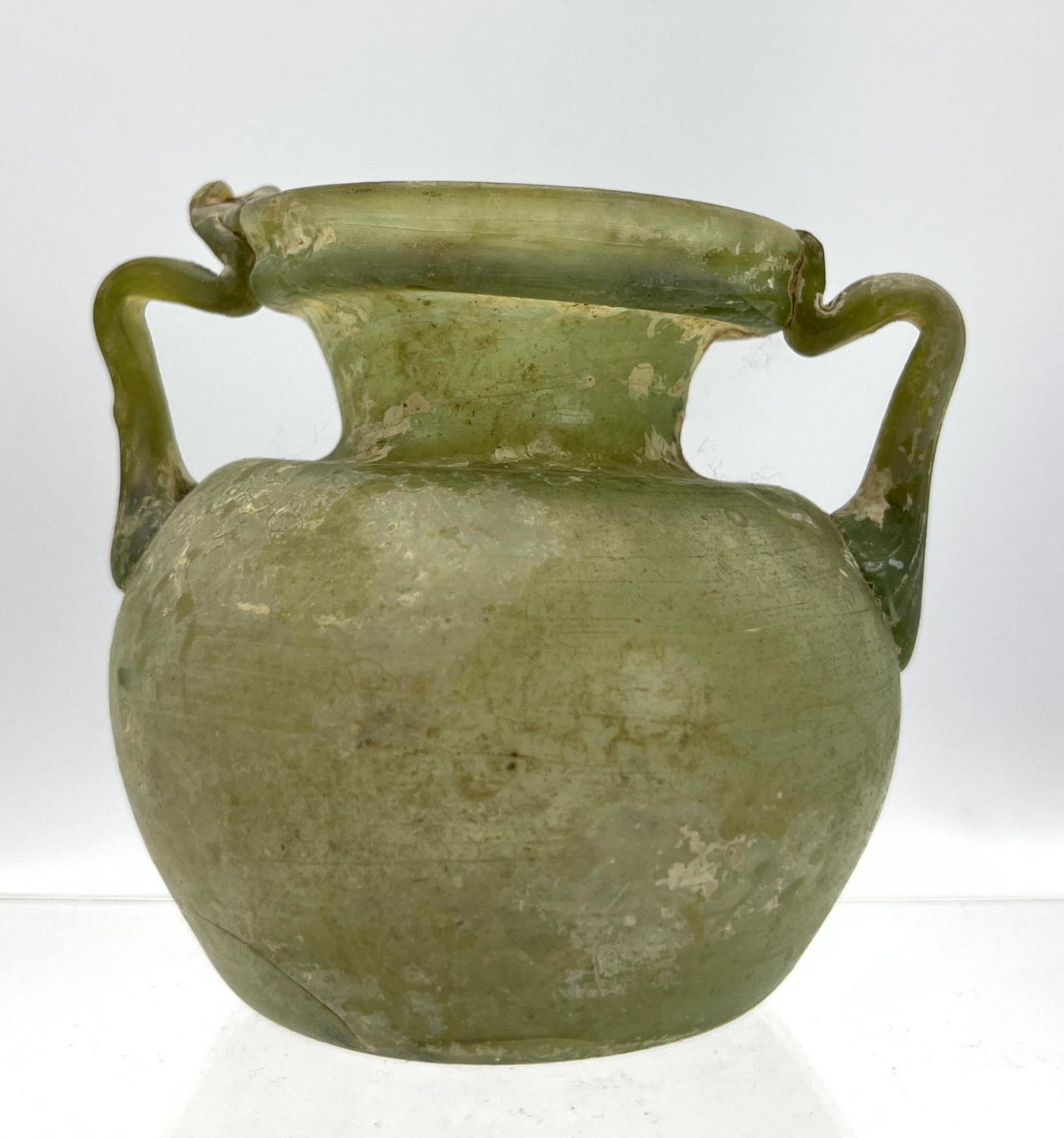 Appraisal: handled vase light green Ancient Roman glass Dimensions H inches