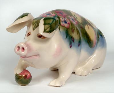 Appraisal: A MOORCROFT POTTERY PETER THE PIG FIGURE modelled sitting with