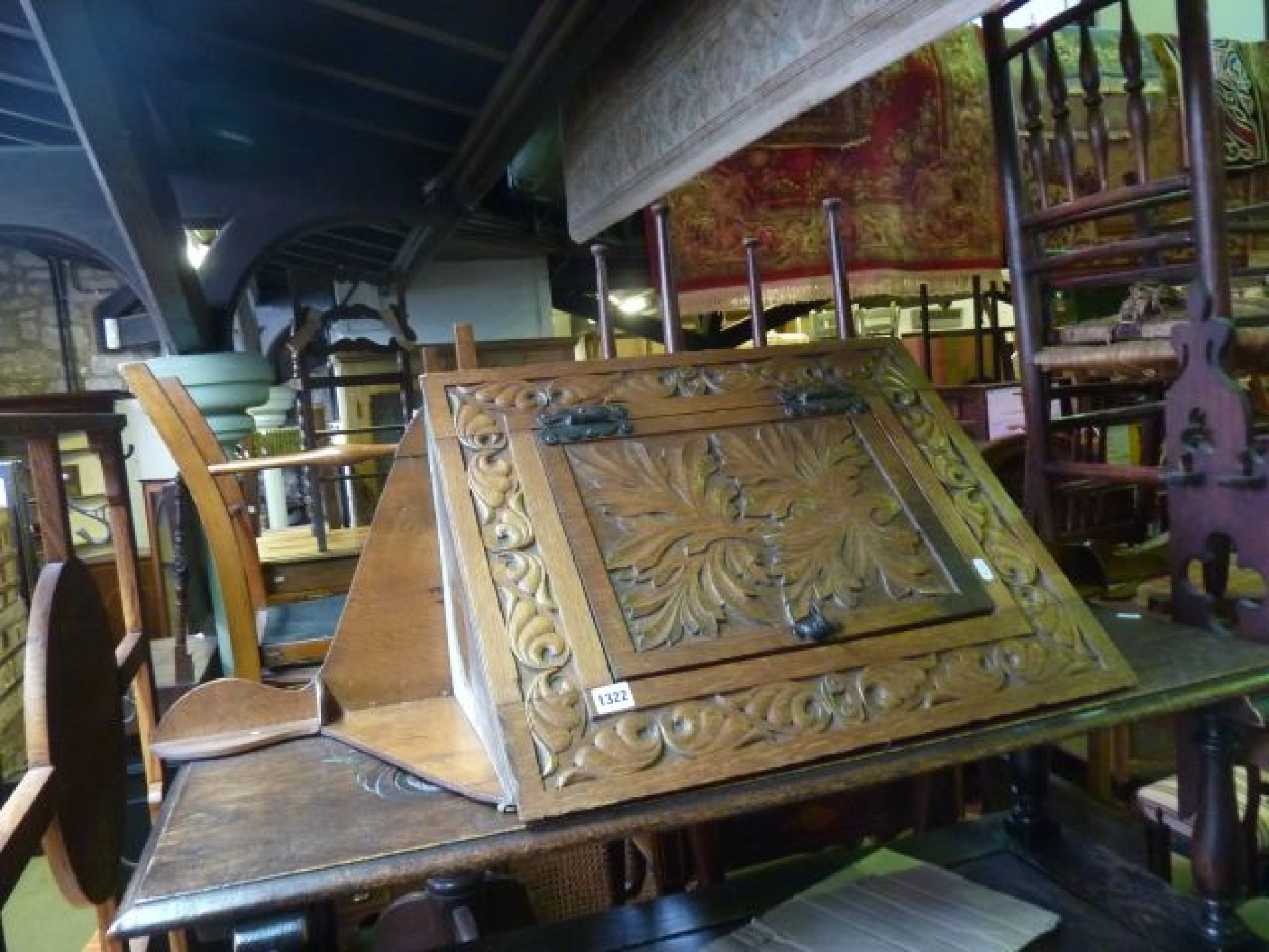 Appraisal: A Victorian oak wall mounted corner cupboard with deep relief