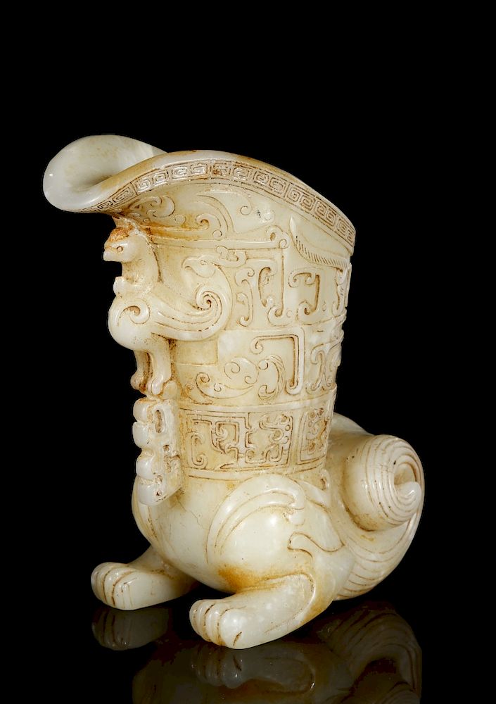 Appraisal: Chinese Celadon and Russet Archaistic Jade Rhyton Carved as the