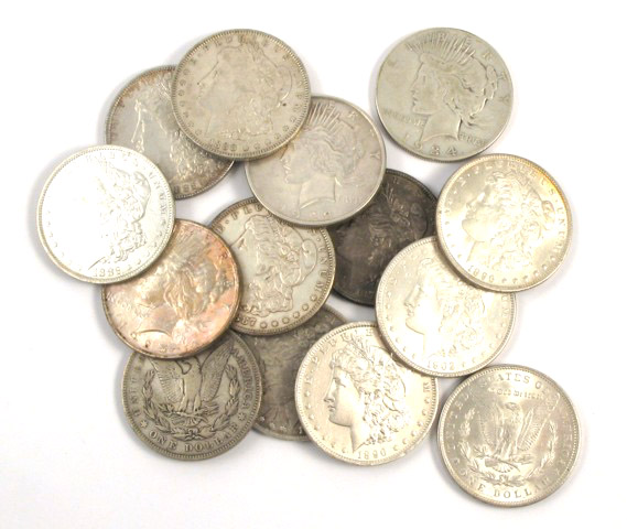 Appraisal: FOURTEEN U S SILVER DOLLARS including Morgan type and Peace