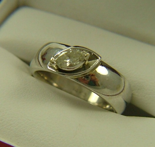 Appraisal: DIAMOND AND FOURTEEN KARAT WHITE GOLD RING set with a