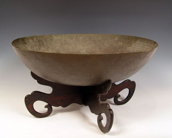 Appraisal: HAND HAMMERED COPPER BOWL ON STAND Hand hammered bowl measures