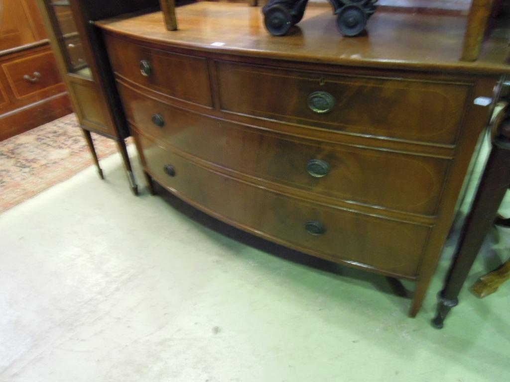 Appraisal: An Edwardian mahogany bow fronted chest in a Georgian style