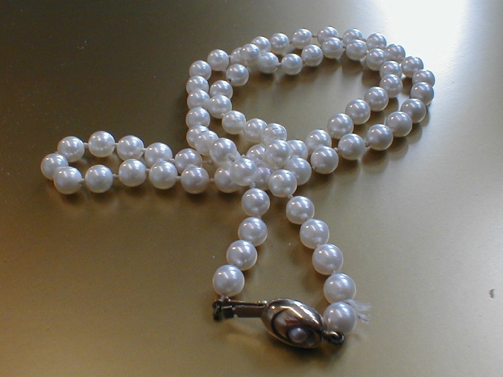 Appraisal: A cultured pearl necklace of mm pearls knotted to pearl