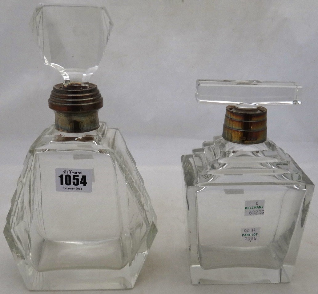 Appraisal: Two silver mounted faceted glass decanters each in a differing