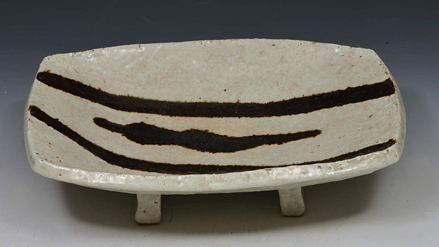 Appraisal: Janet Leach American - Dish on slab feet poured tenmoku