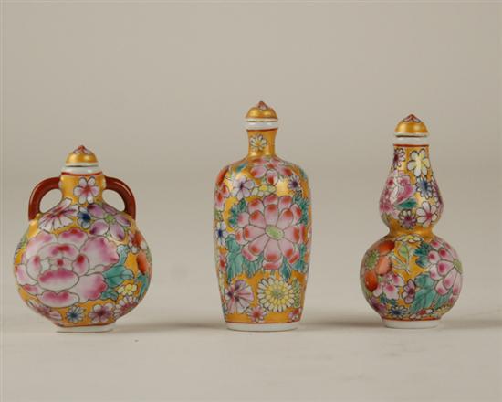 Appraisal: Three Enameled Porcelain Snuff Bottles one squat and rounded with