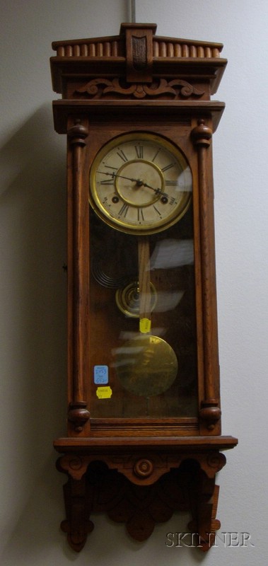 Appraisal: Oak Waterbury Wall Clock with pressed carved cornice paper on