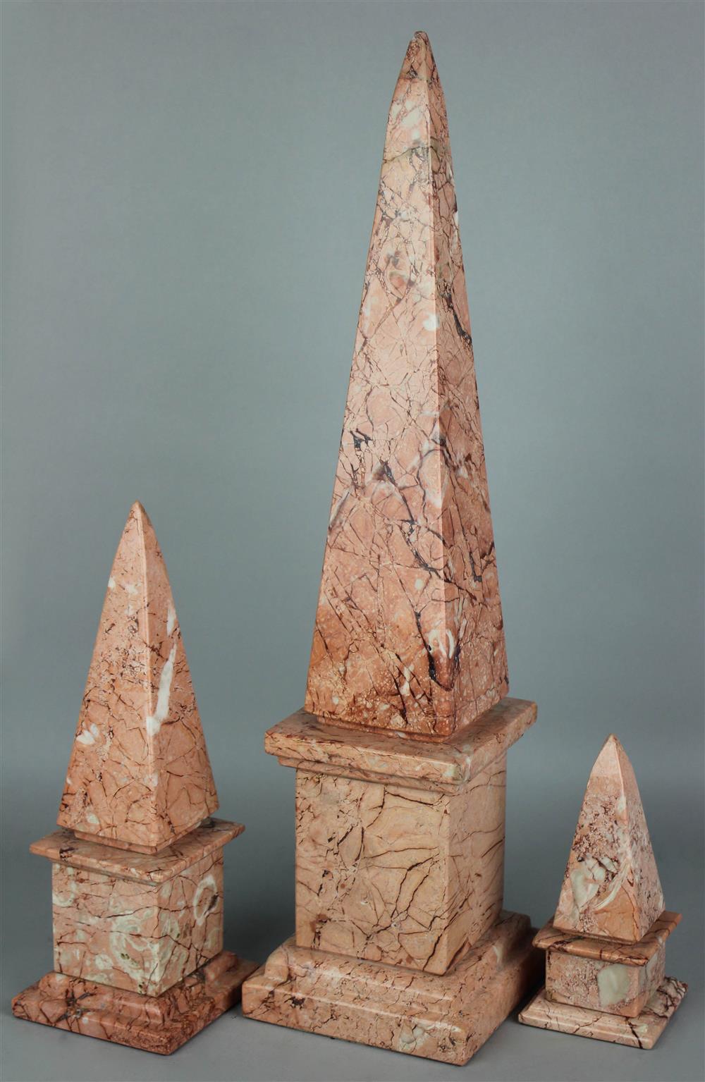 Appraisal: SET OF THREE POLISHED ROSE MARBLE GRADUATED OBELISKS h in