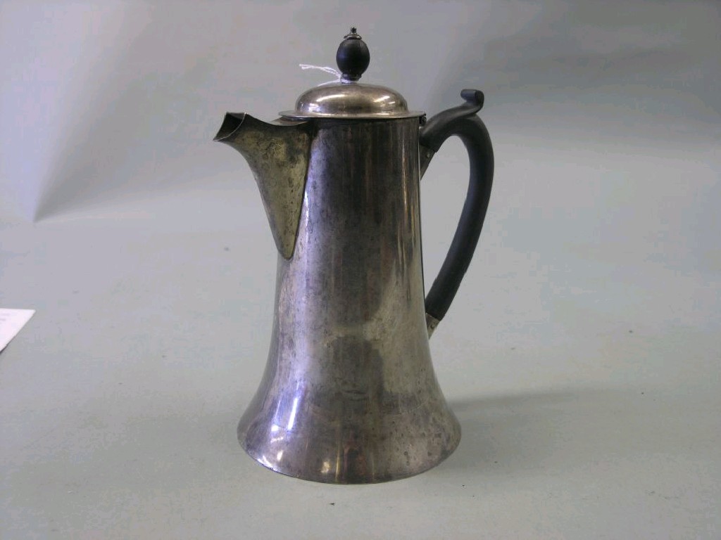 Appraisal: A silver hot water jug with ebony handle Birmingham in