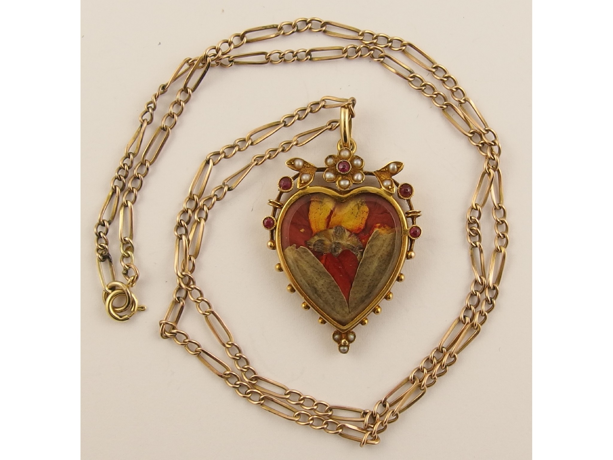 Appraisal: An ct double sided heart shaped open locket set with