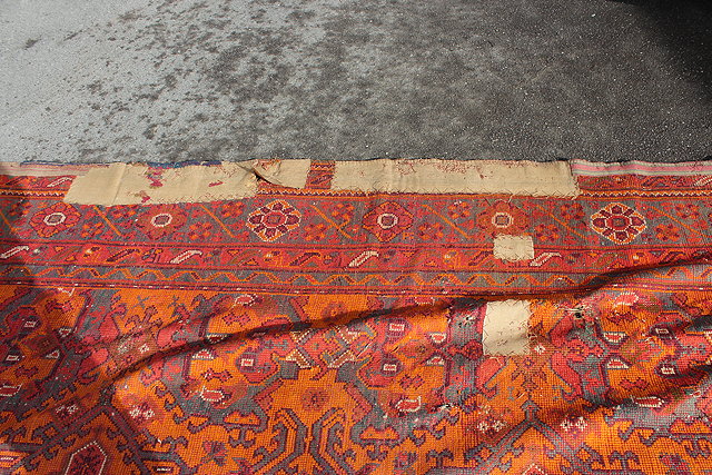 Appraisal: A LARGE ANTIQUE ORANGE GROUND TURKEY CARPET with stylised floral