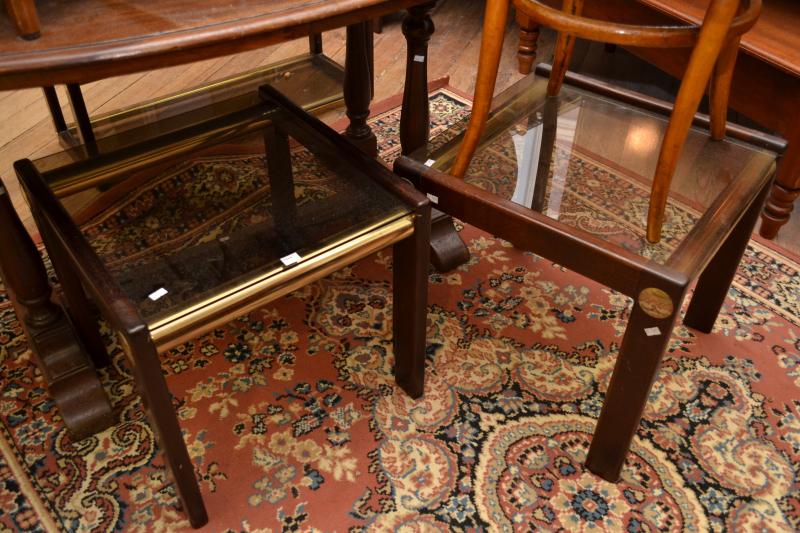 Appraisal: A PAIR OF MODERN OCCASIONAL TABLES WITH SMOKED GLASS TOPS