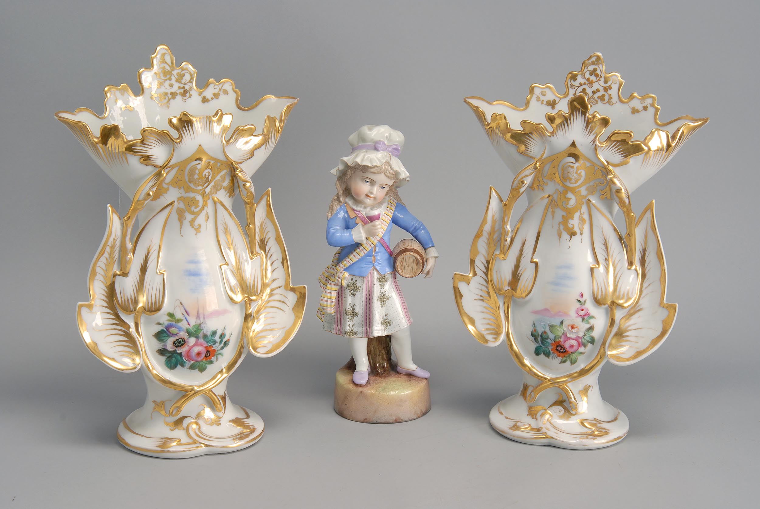 Appraisal: THREE PIECES OF PORCELAIN German porcelain figure of a girl