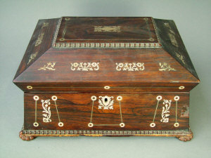 Appraisal: A late Regency figured rosewood sewing casket with mother-of-pearl inlaid