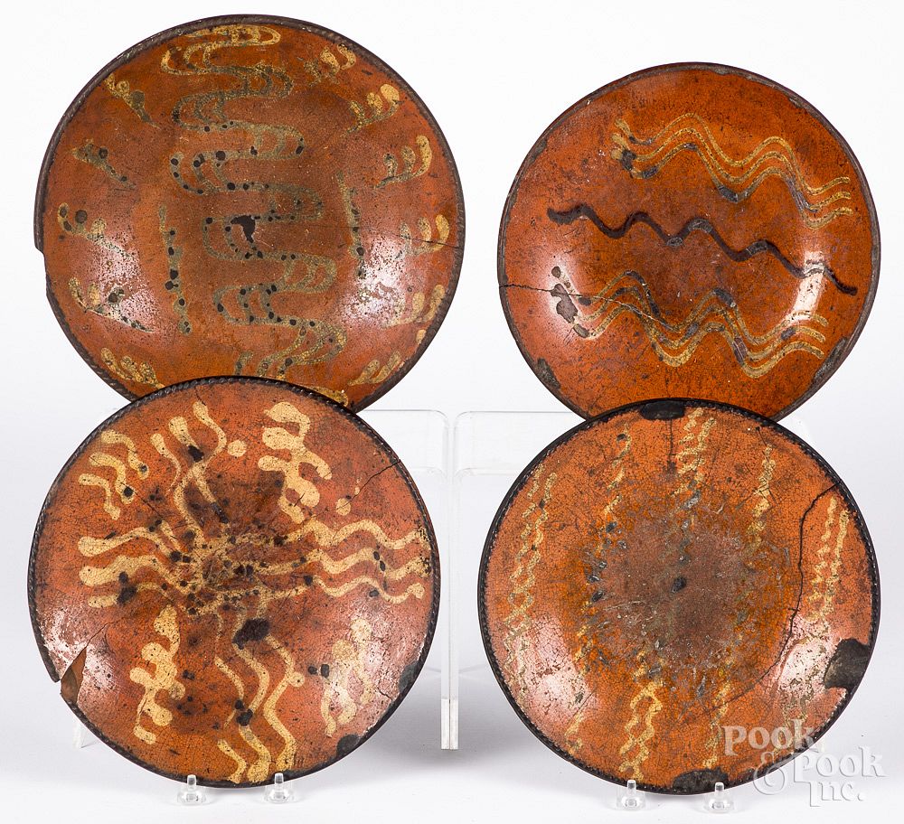 Appraisal: Four redware chargers th c Four redware chargers th c