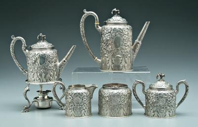 Appraisal: Repouss eacute sterling tea service cylindrical with rounded shoulders and