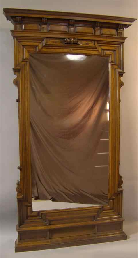 Appraisal: MONUMENTAL AMERICAN VICTORIAN WALNUT MIRROR late th century the molded