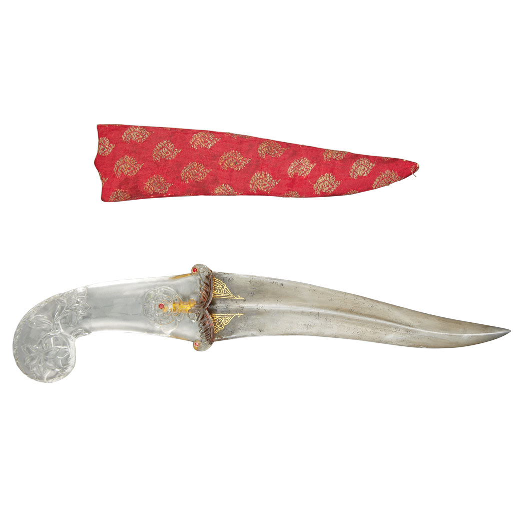 Appraisal: Indian Dagger The clear glass scrolled handle worked in relief