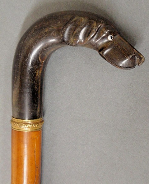 Appraisal: Carved hound head walking stick th c with glass eyes