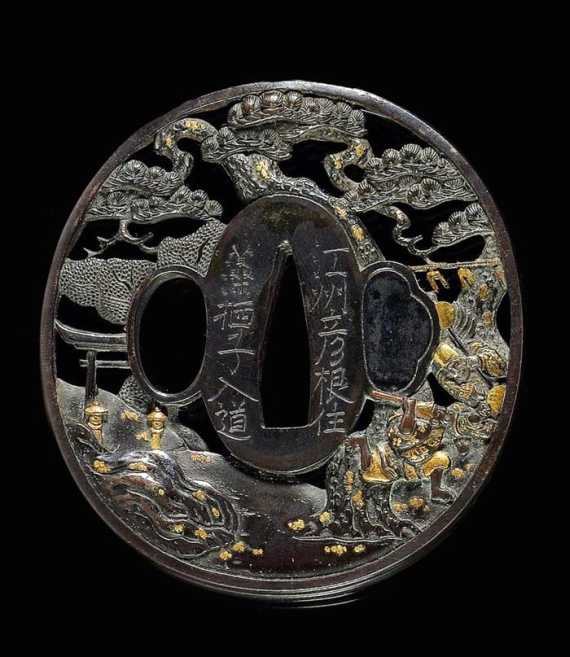 Appraisal: A SHAKUD TSUBA OF TWO MEN FIGHTING NEAR A TEMPLE