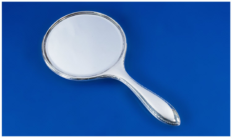 Appraisal: A Useful Silver Hand Mirror with Egg and Dart Border