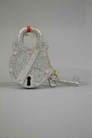 Appraisal: DRESDEN PADLOCK CANDY CONTAINER Finely embossed example with top that